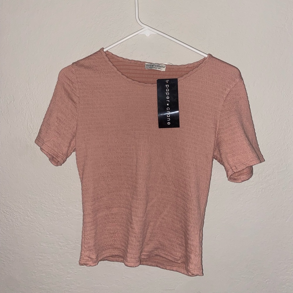 Never worn, color pink, and size XS I believe in women!